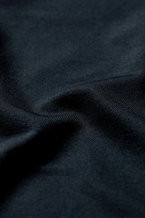 Our moisture wicking CoolNylon fabric absorbs more sweat than cotton, yet dries faster. 146gsm. Black